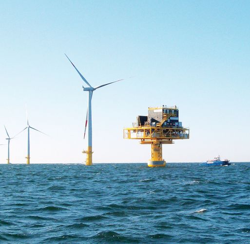 Triton Knoll offshore wind park with turbines and substation during sunny weather