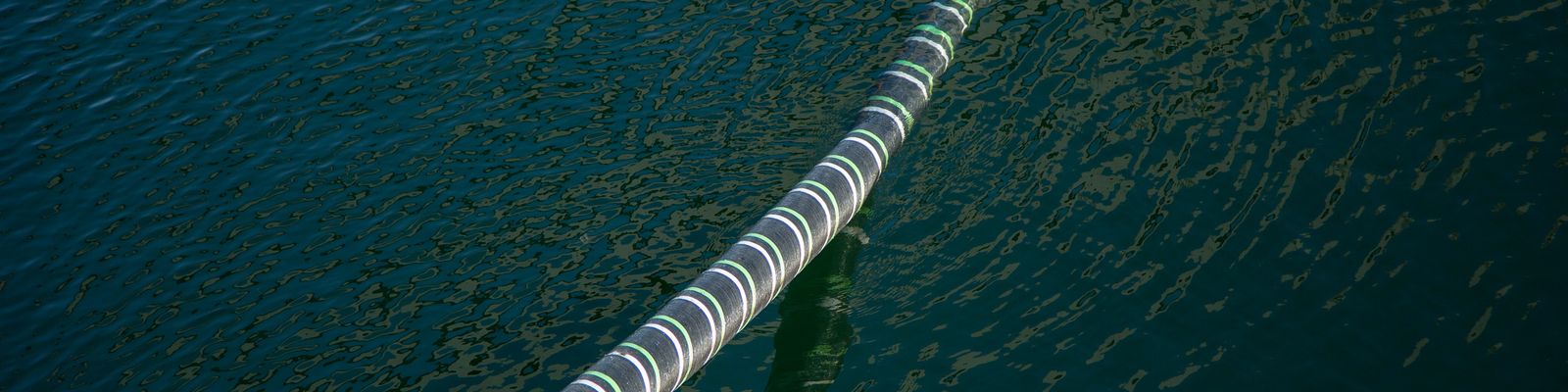 Cable Hanging Over Sea Water